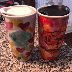 Two Starbucks travel mugs